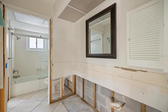 a bathroom with a bathtub and a sink