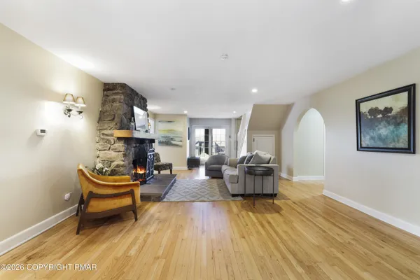 a kitchen with granite countertop a stove and a microwave