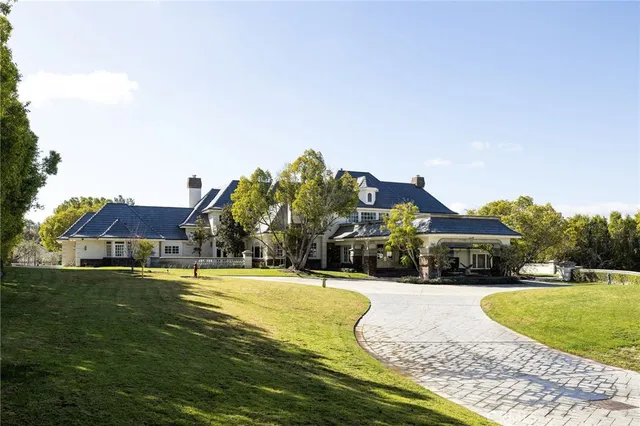 a view of a house with a swimming pool