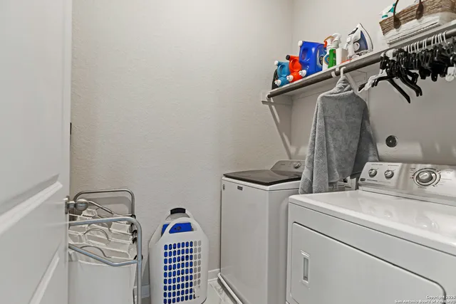 a view of storage and utility room with washer and dryer