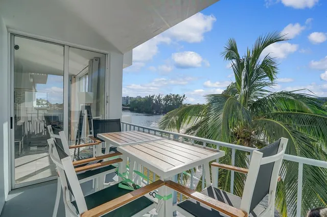 a view of a balcony with chairs