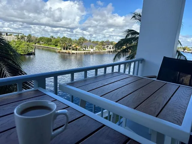 a balcony with a table and chairs