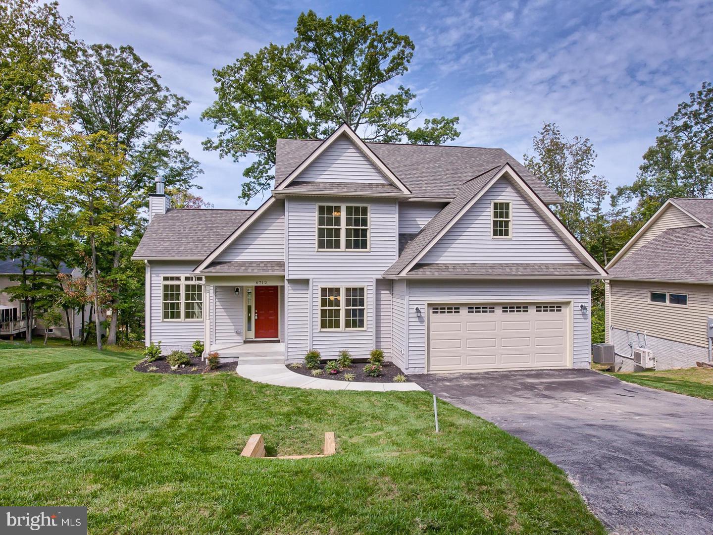 6712 Ridgecrest Road New Market, MD 21774 - Photo 1 of 69 a front view of a house with a yard and porch