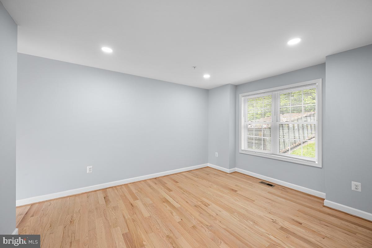 6712 Ridgecrest Road New Market, MD 21774 - Photo 34 of 69 an empty room with wooden floor and windows