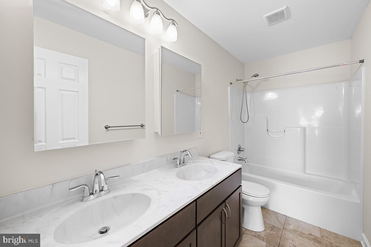 6712 Ridgecrest Road New Market, MD 21774 - Photo 54 of 69 a bathroom with a sink a toilet and shower