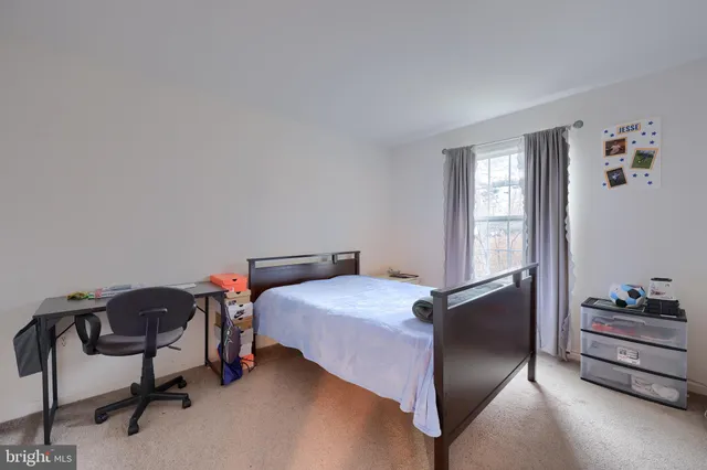 a bedroom with a bed and cabinets