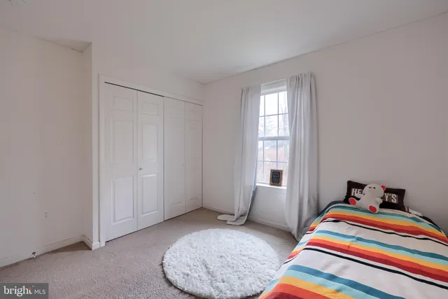 a room with a bed and a window