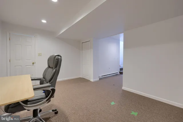 a view of a workspace with furniture