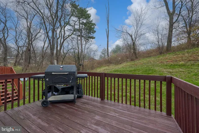 a view of balcony with wooden floor and outdoor seating
