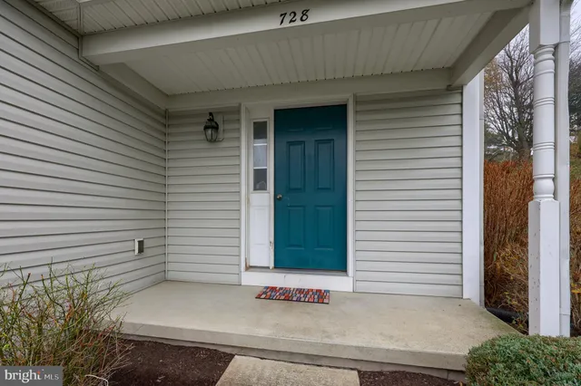 a view of a door and a window