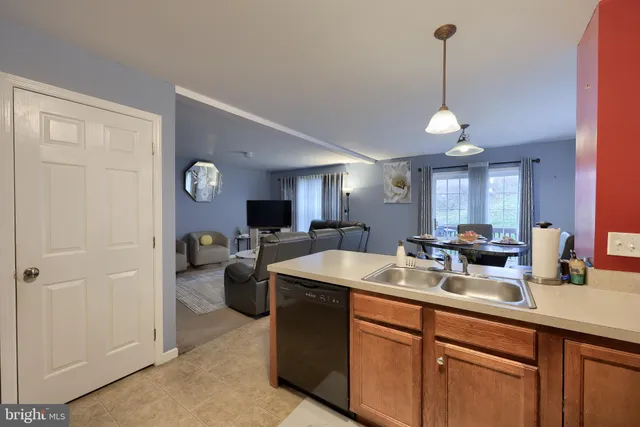 a kitchen with a sink and a refrigerator