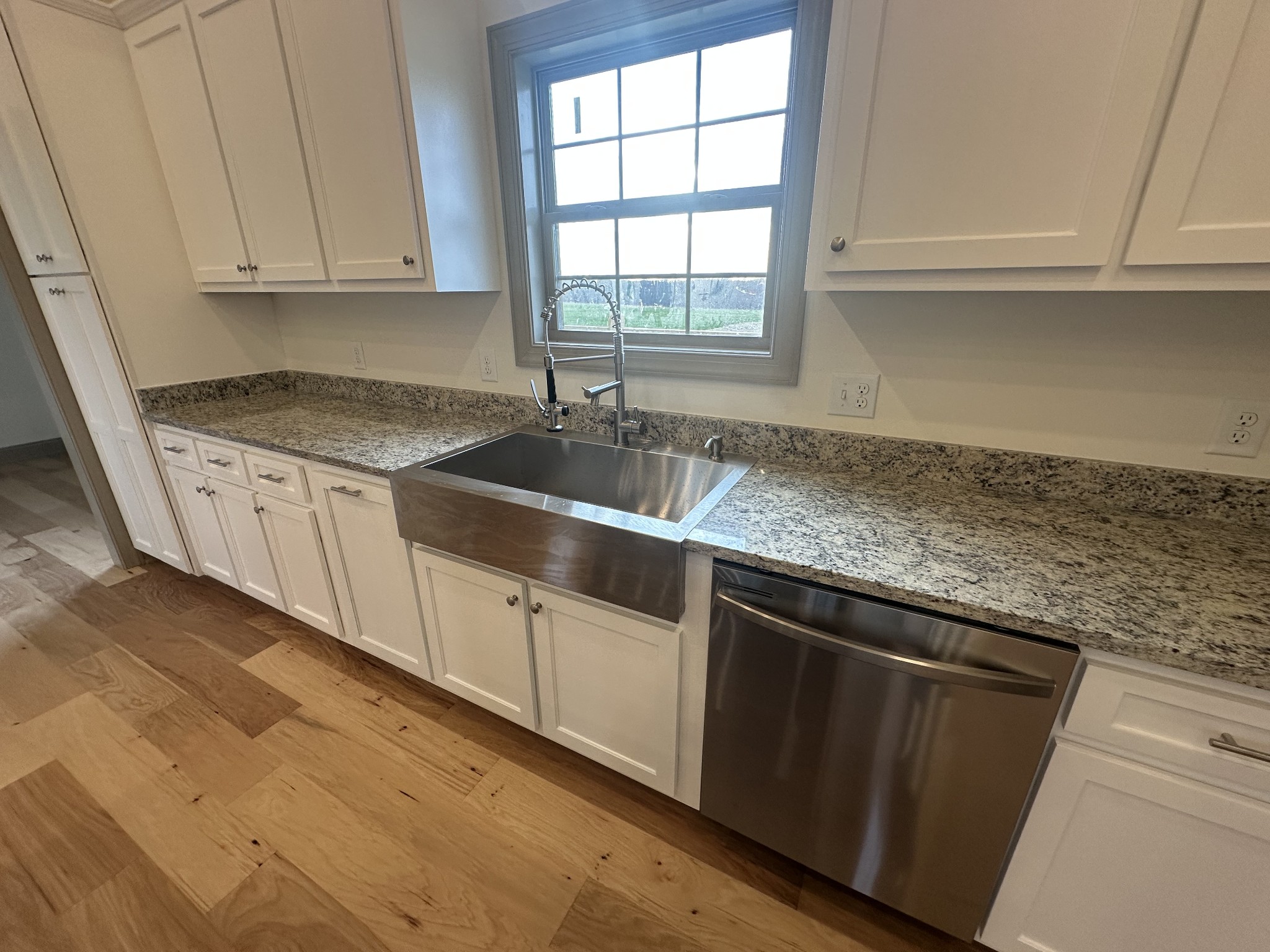 5151 Galen Road Lafayette, TN 37083 - Photo 36 of 37 a kitchen with granite countertop a sink and cabinets