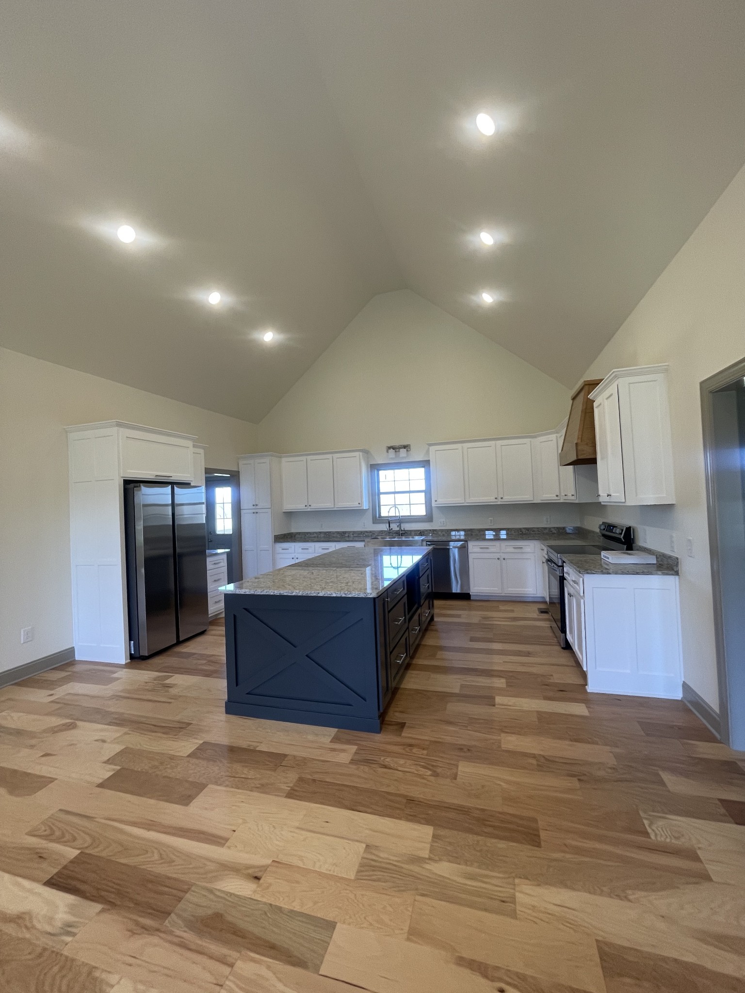 5151 Galen Road Lafayette, TN 37083 - Photo 6 of 37 a kitchen with stainless steel appliances kitchen island a cabinets and wooden floor