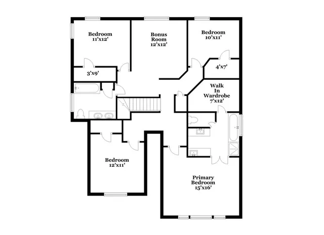 a view of an empty room and kitchen view