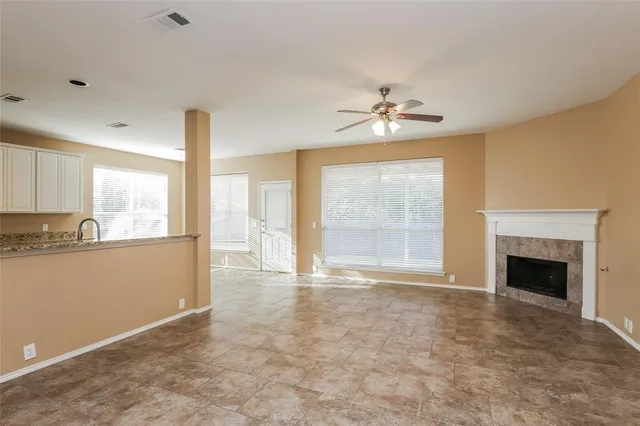 a kitchen with a refrigerator and a sink