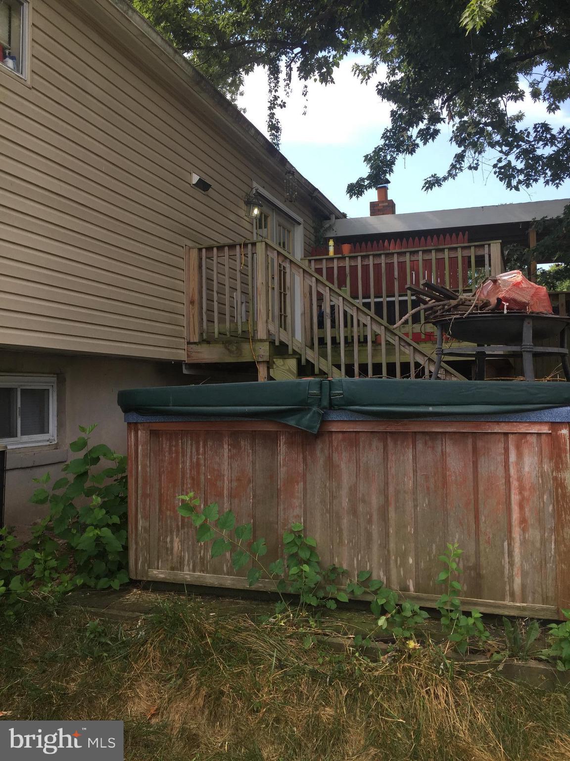 7732 Notley Road Pasadena, MD 21122 - Photo 50 of 51 Large upper level deck off back with hot tub.