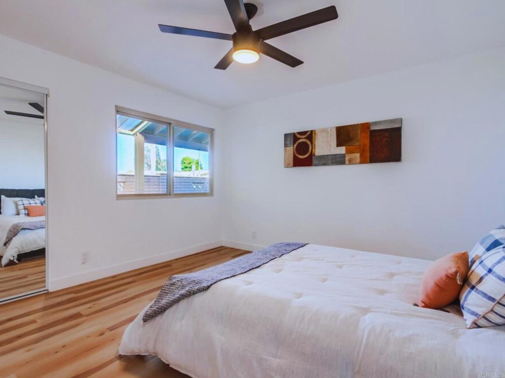 1025 Plover Way Oceanside, CA 92057 - Photo 15 of 36 a bedroom with bed and window