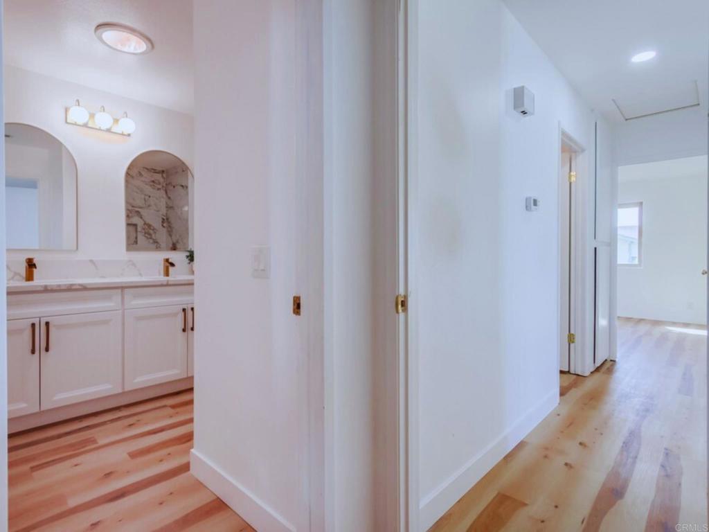 1025 Plover Way Oceanside, CA 92057 - Photo 20 of 36 a bathroom with a sink and a mirror