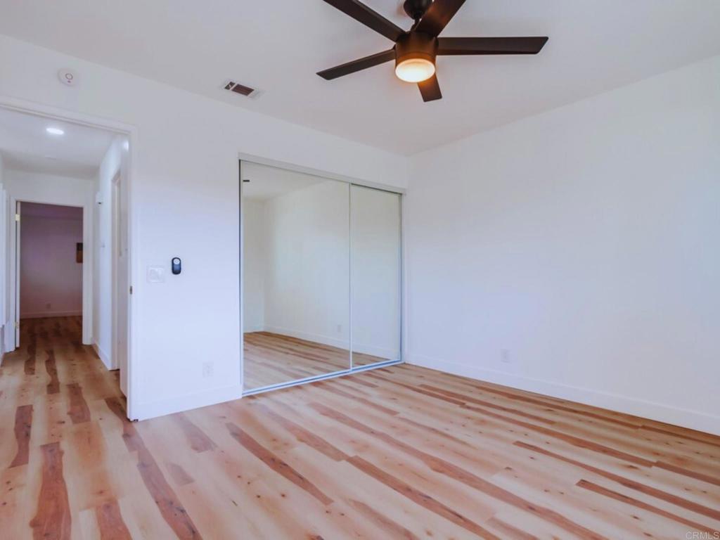 1025 Plover Way Oceanside, CA 92057 - Photo 21 of 36 wooden floor in an empty room with a window