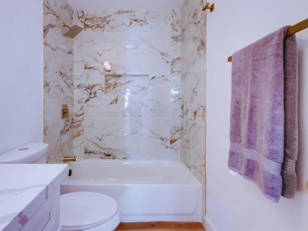 1025 Plover Way Oceanside, CA 92057 - Photo 24 of 36 a bathroom with a bathtub and shower