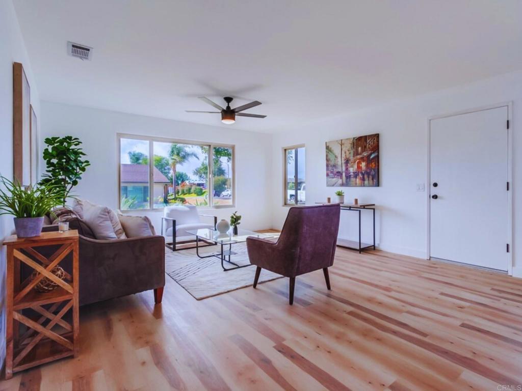 1025 Plover Way Oceanside, CA 92057 - Photo 3 of 36 a living room with furniture and a wooden floor