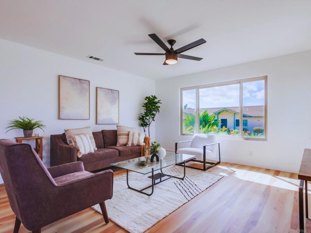 1025 Plover Way Oceanside, CA 92057 - Photo 4 of 36 a living room with furniture and a potted plant