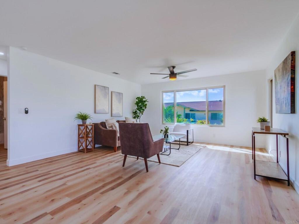 1025 Plover Way Oceanside, CA 92057 - Photo 6 of 36 a living room with furniture and a wooden floor
