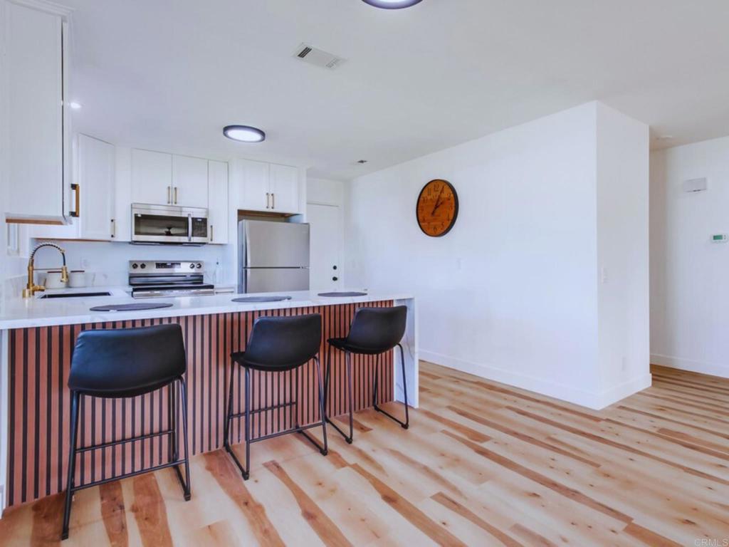 1025 Plover Way Oceanside, CA 92057 - Photo 9 of 36 a kitchen with a sink cabinets and window