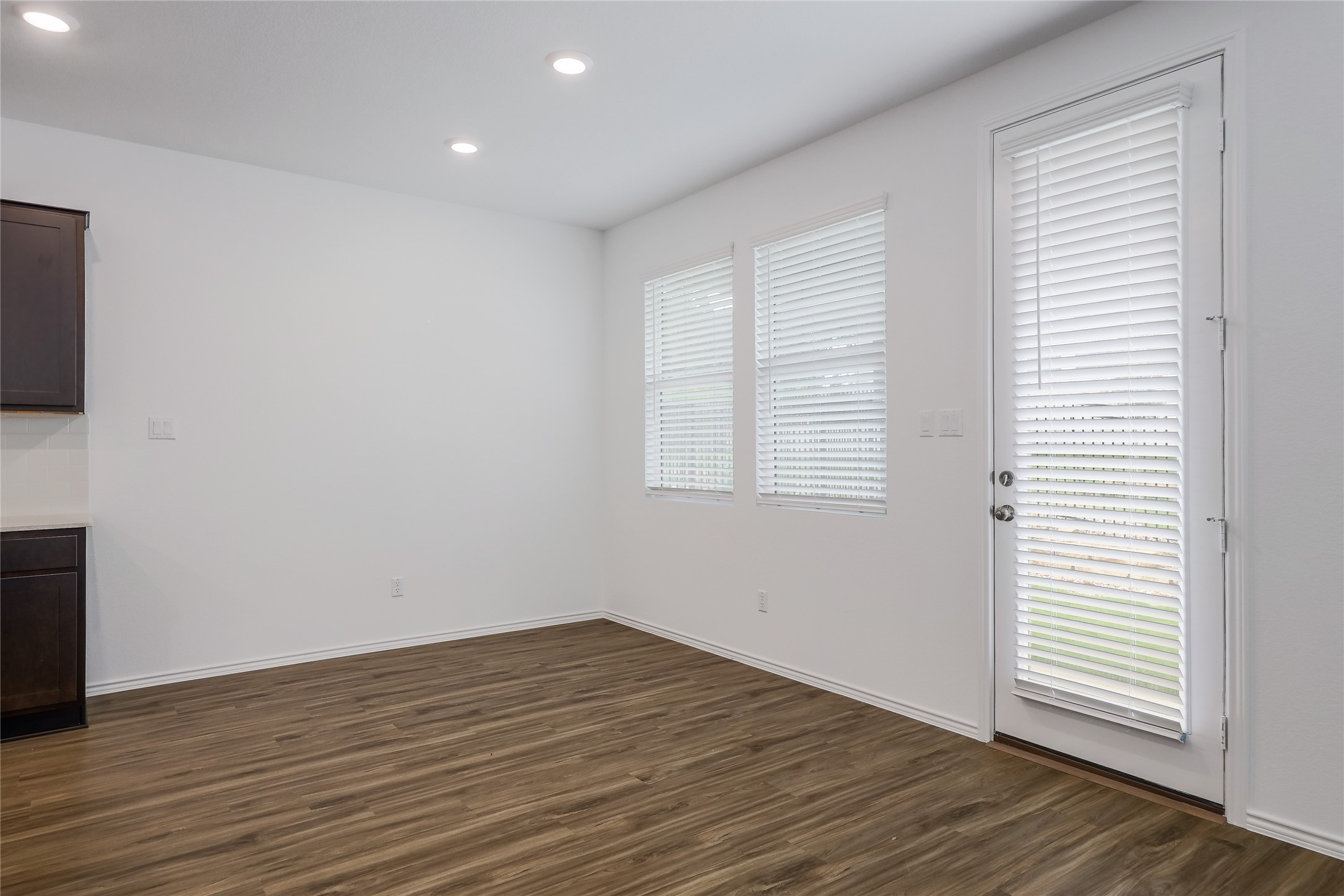 818 Affazia Lane Georgetown, TX 78628 - Photo 11 of 27 a view of empty room with wooden floor and fan