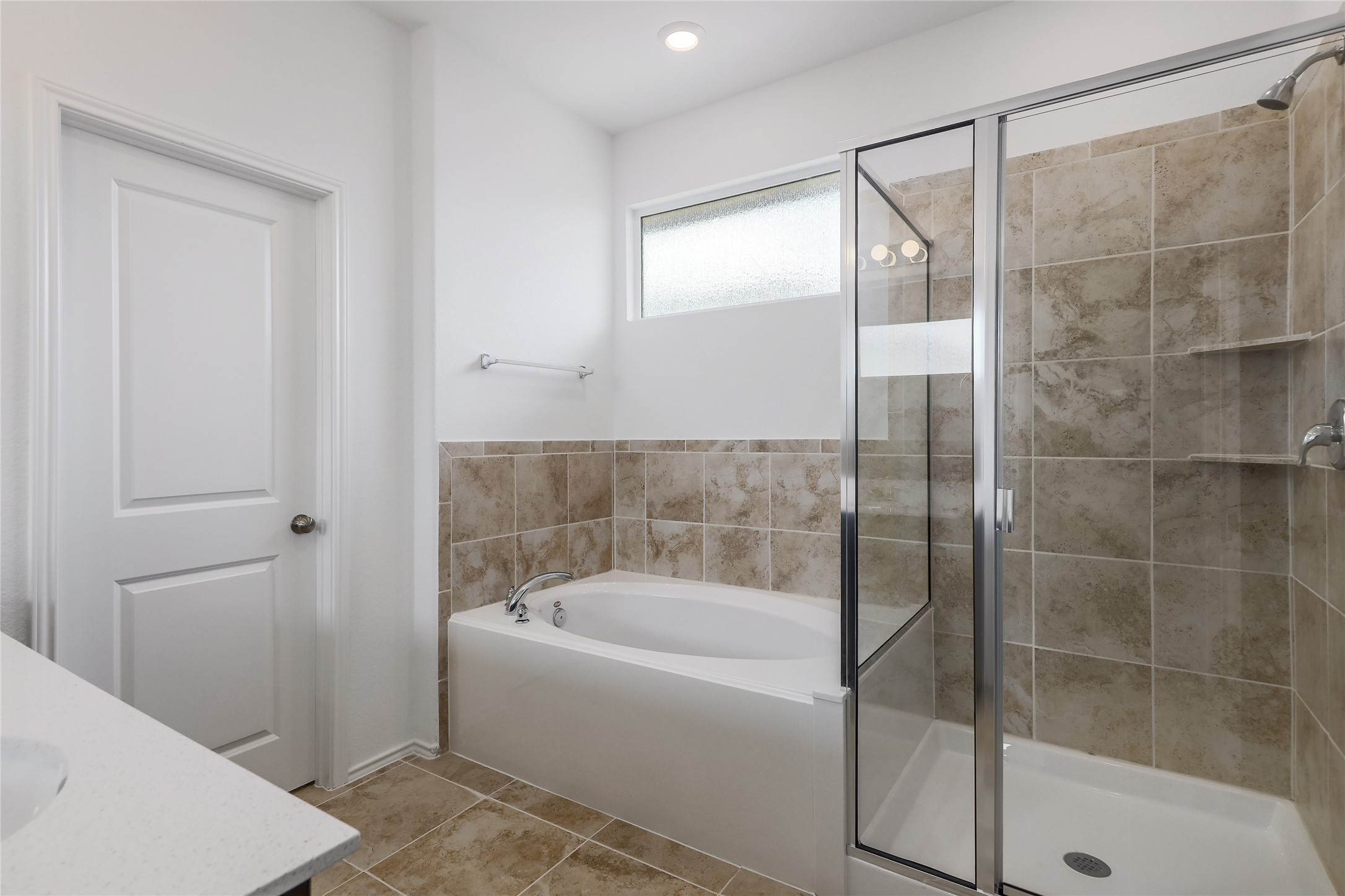 818 Affazia Lane Georgetown, TX 78628 - Photo 16 of 27 a bathroom with a bathtub and a shower