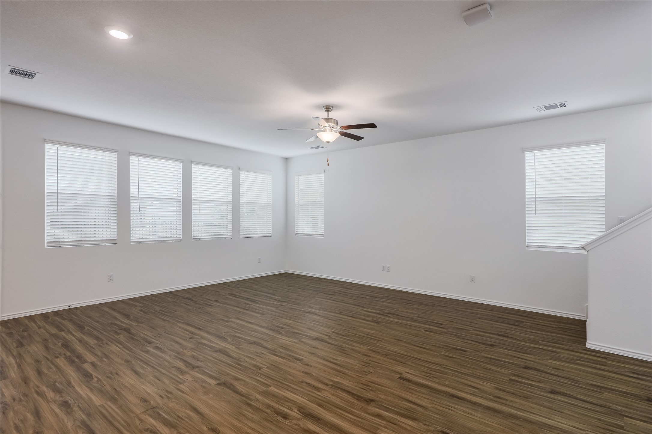 818 Affazia Lane Georgetown, TX 78628 - Photo 3 of 27 a view of an empty room with wooden floor and a window