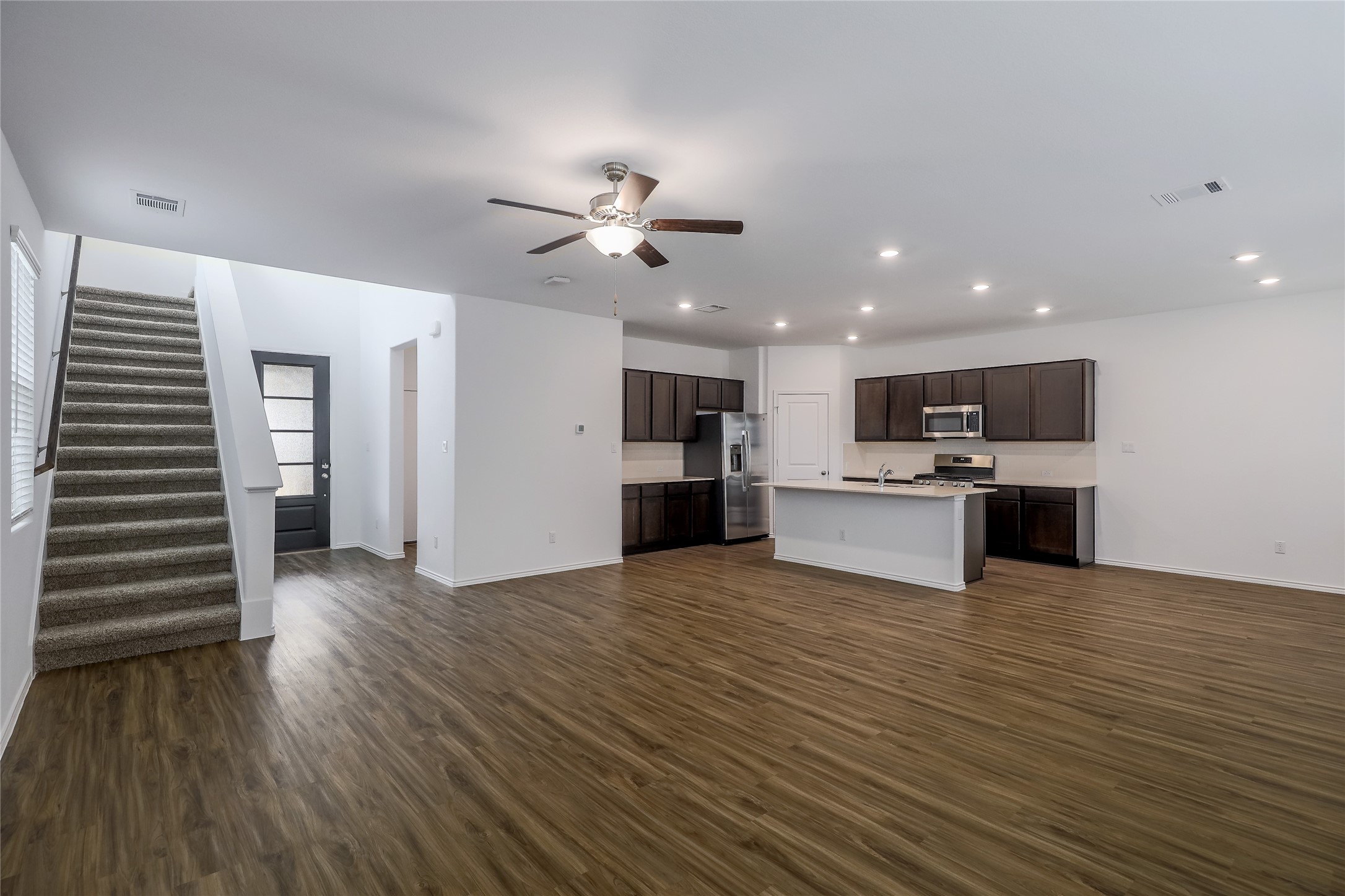 818 Affazia Lane Georgetown, TX 78628 - Photo 5 of 27 a view of kitchen with cabinets and wooden floor