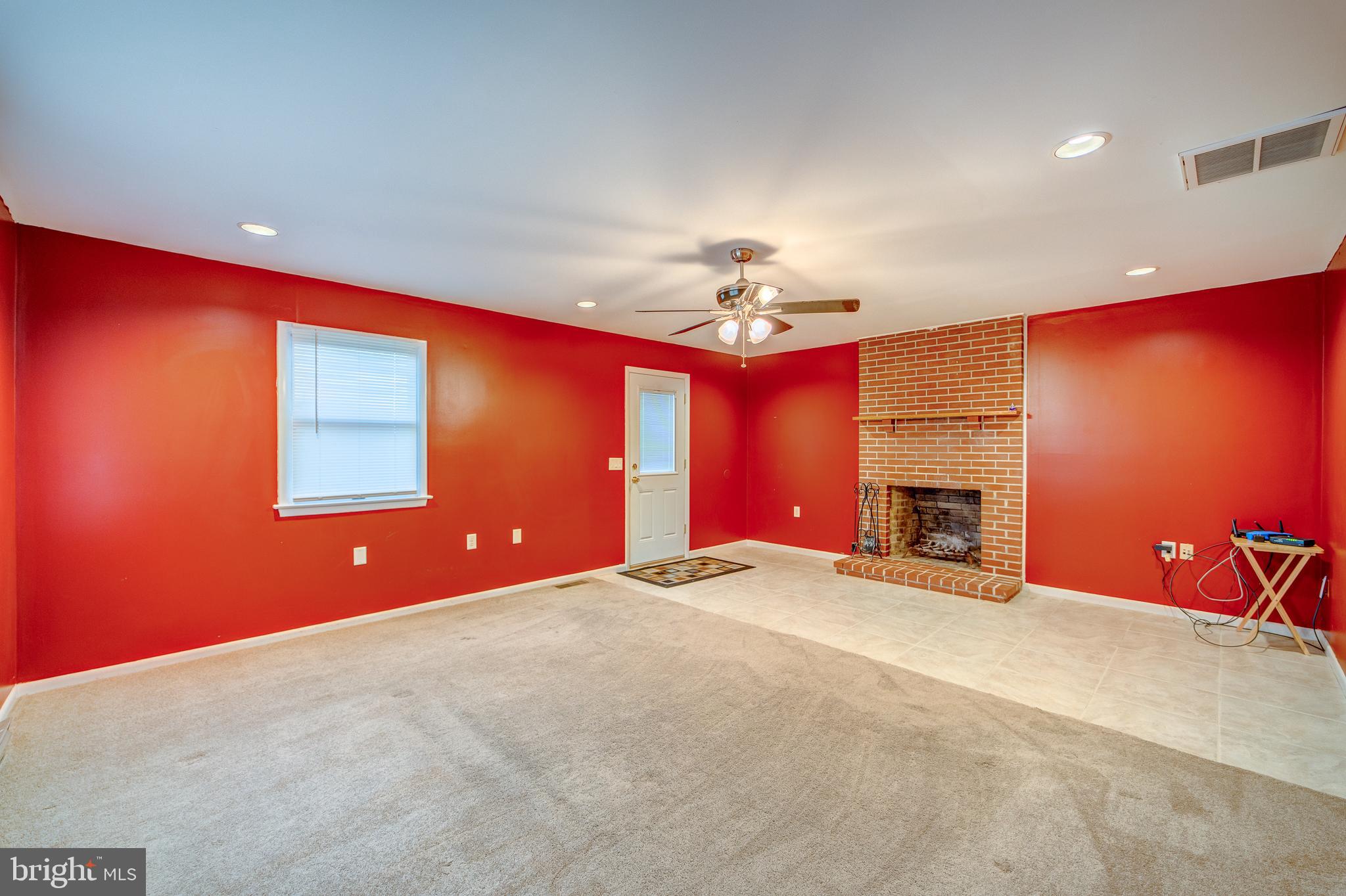 205 Newtown Road Chester, MD 21619 - Photo 38 of 53 Family room with side entrance, tile & carpet.