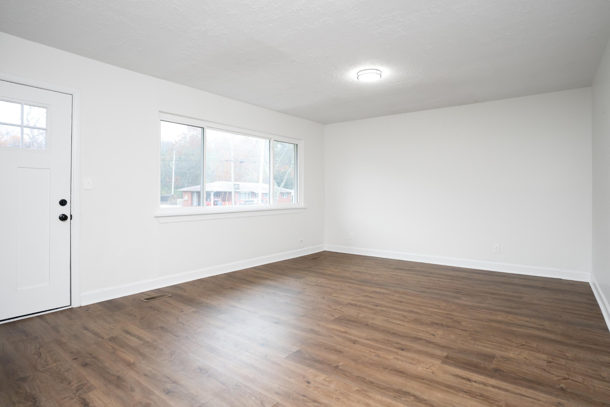 151 Sharon Circle Rossville, GA 30741 - Photo 12 of 21 an empty room with wooden floor and windows