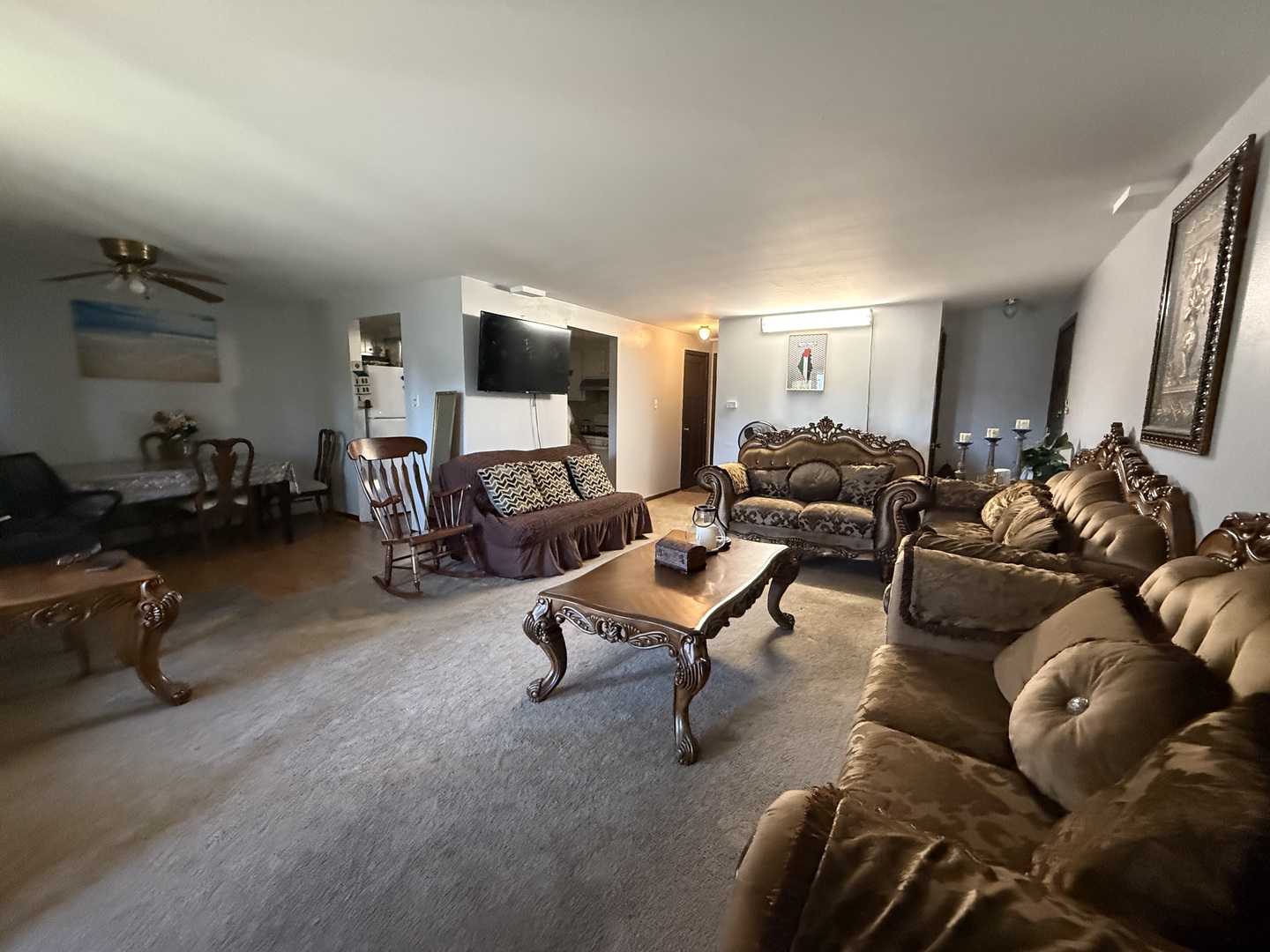 7100 99th Street, Unit 204 Chicago Ridge, IL 60415 - Photo 7 of 9 a living room with furniture and a flat screen tv