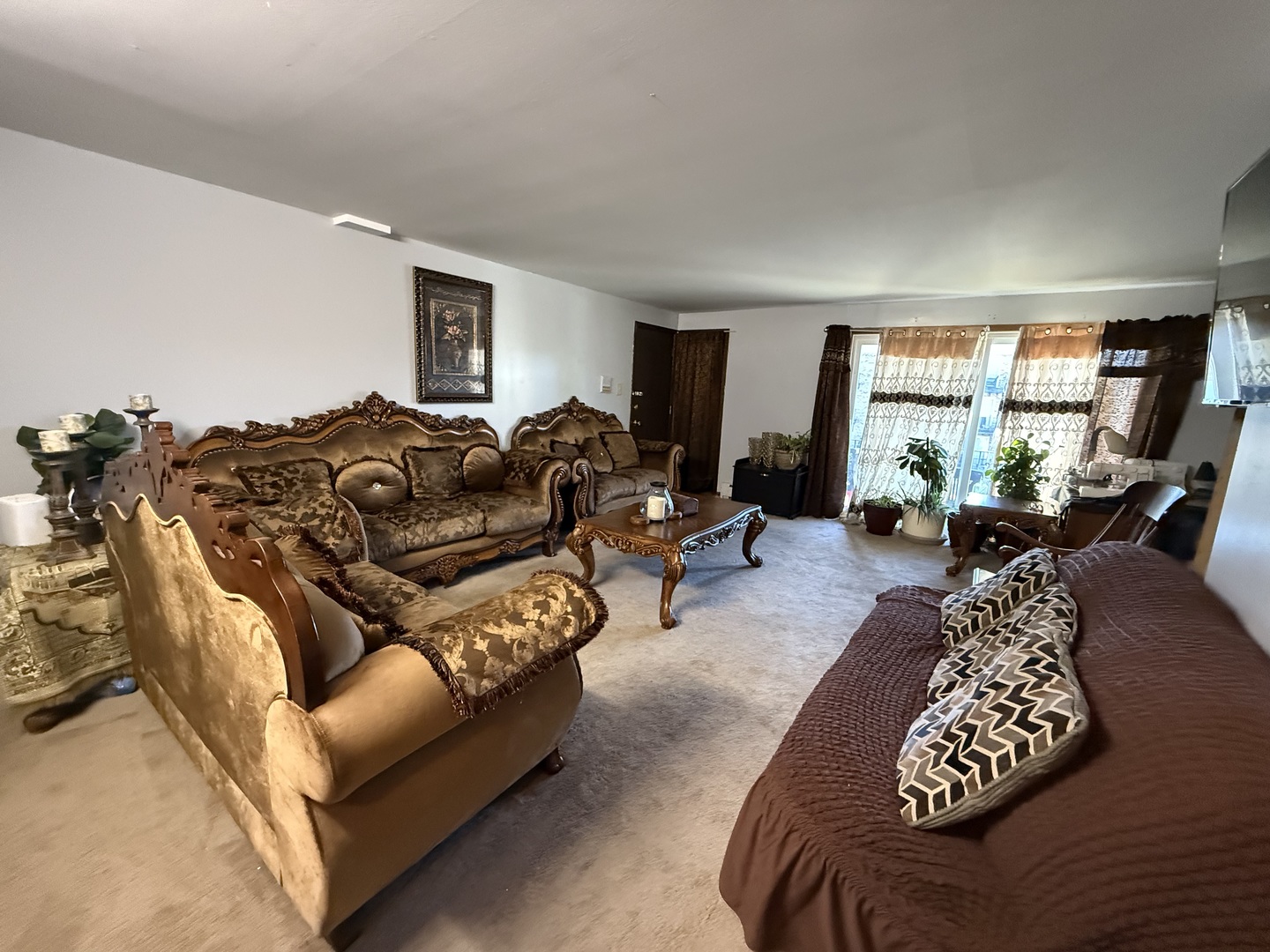 7100 99th Street, Unit 204 Chicago Ridge, IL 60415 - Photo 8 of 9 a living room with furniture and a large window