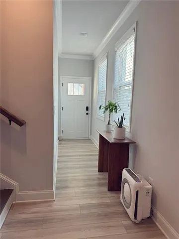 a room with wooden floor and window