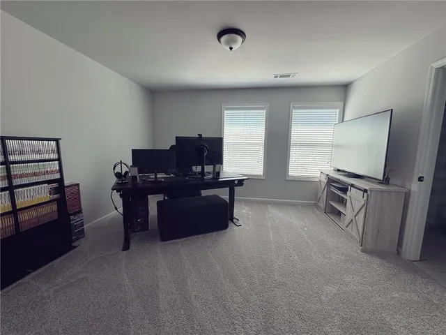 a room with furniture and a flat screen tv