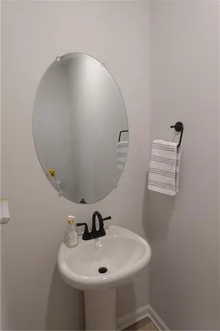 a bathroom with a sink and mirror