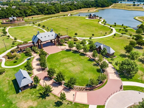 a view of a swimming pool with lawn chairs