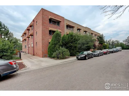 a view of a street with cars