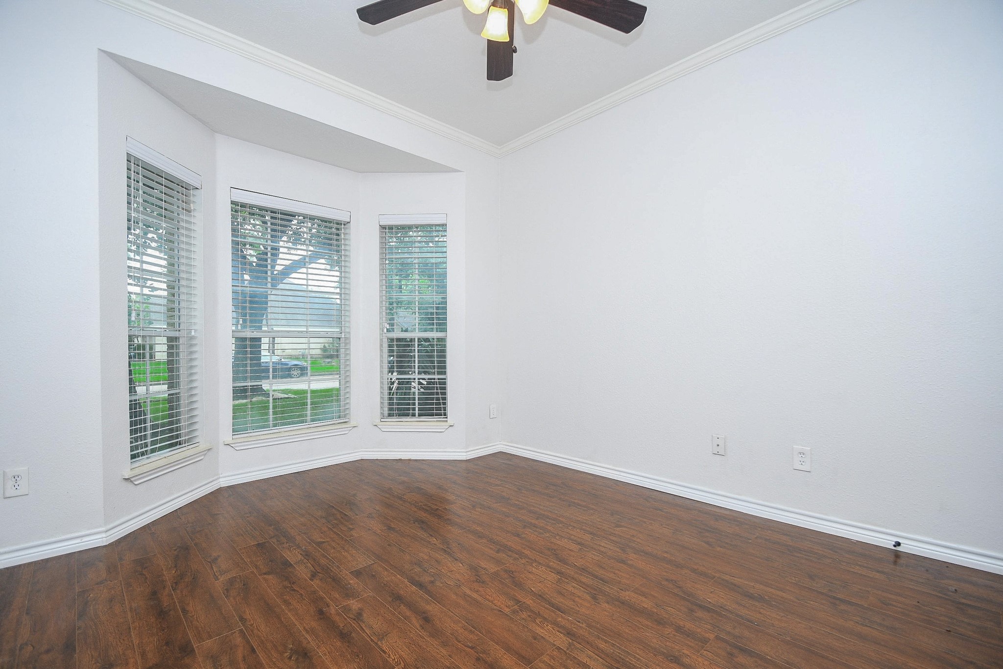 5602 Walkabout Way Katy, TX 77450 - Photo 24 of 33 a view of an empty room with window and wooden floor