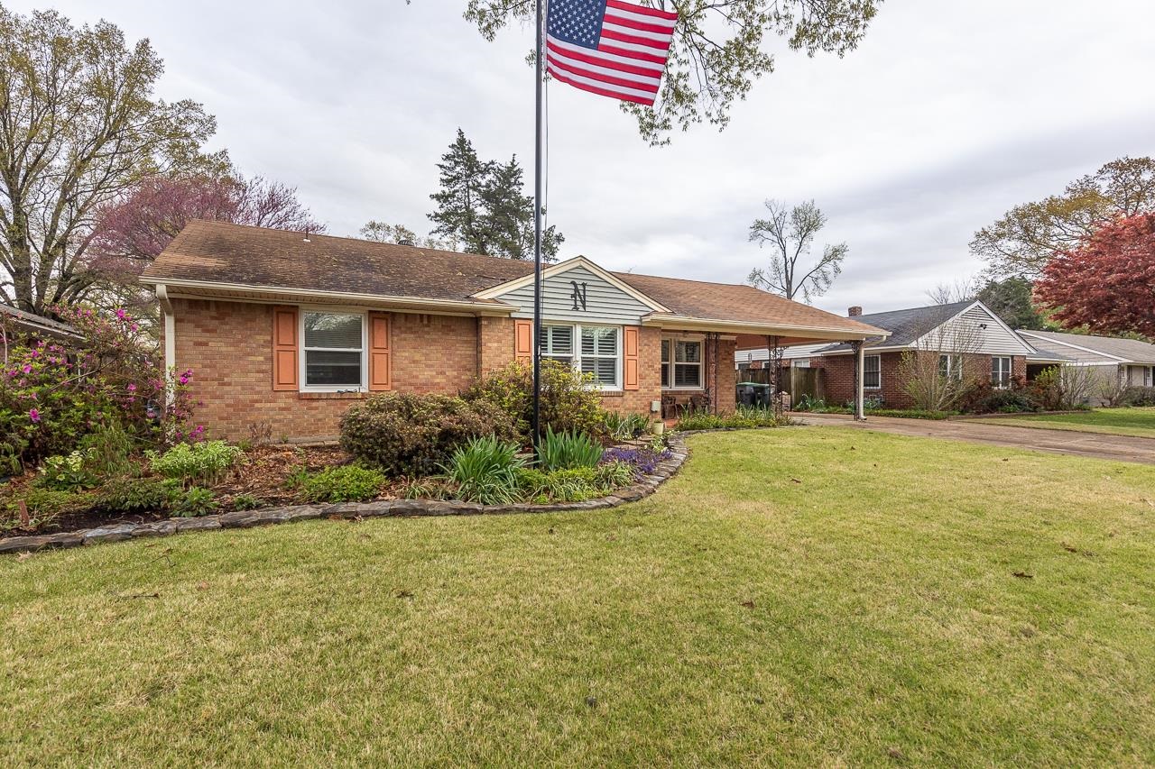 5130 Mason Road Memphis, TN 38117 - Photo 2 of 26 a front view of a house with a yard