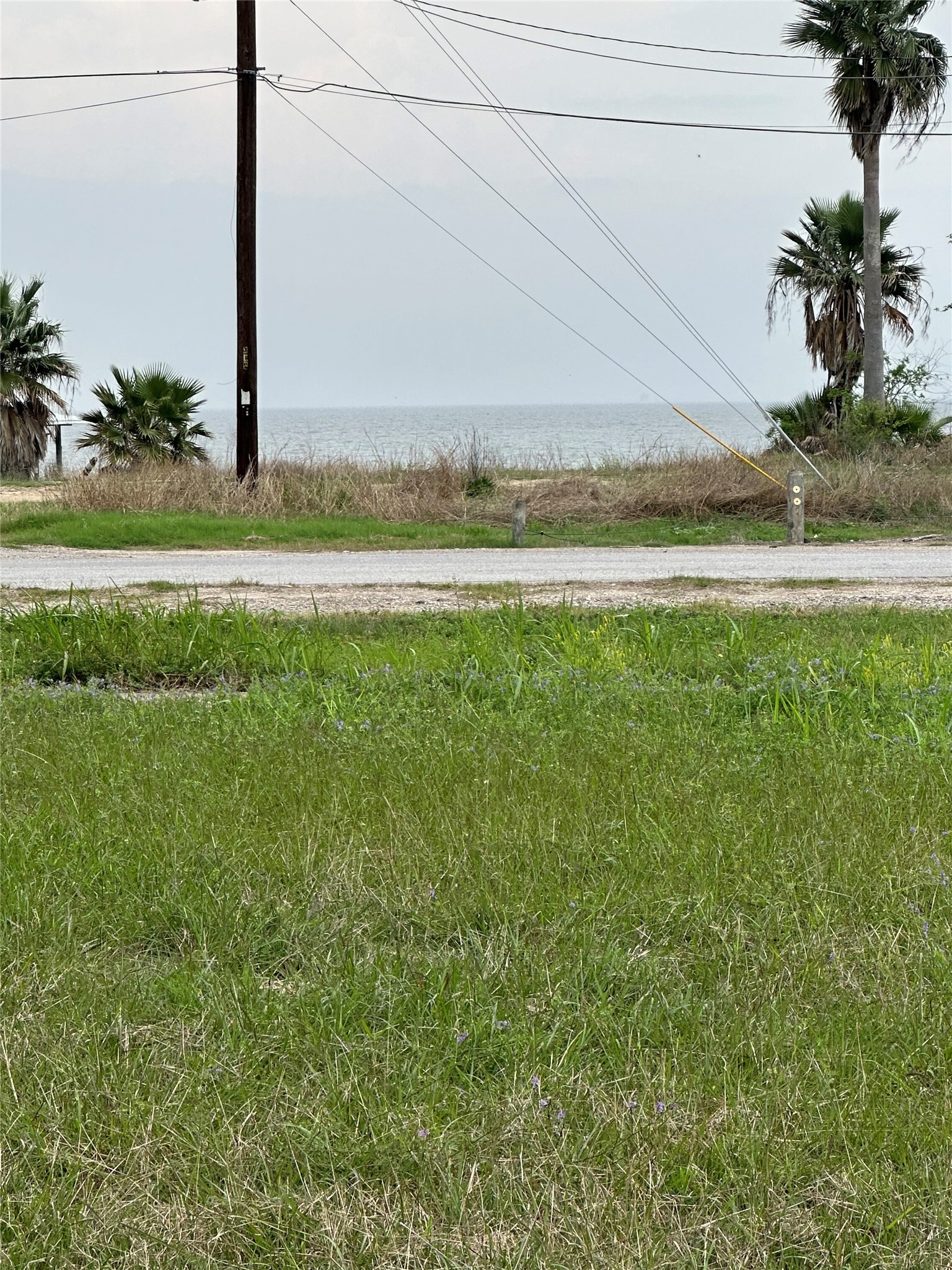 1 Jackson Avenue Bacliff, TX 77518 - Photo 5 of 6 a view of a swimming pool with an outdoor space and seating area