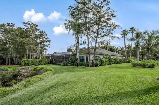 a view of a garden with a building in the background