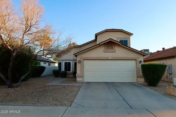a front view of a house with a garage