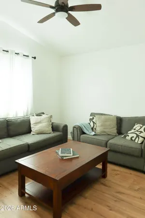 a living room with furniture and a rug