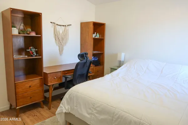 a bedroom with a bed and cabinets