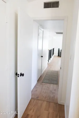 a en suite bathroom with a granite countertop sink