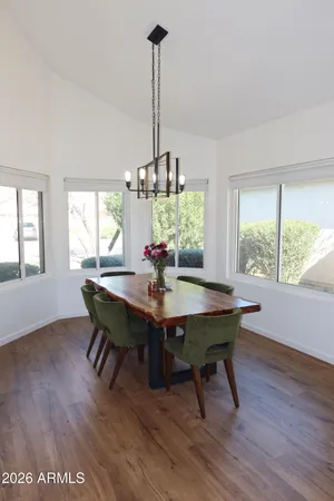 a view of a dining room with furniture window and wooden floor